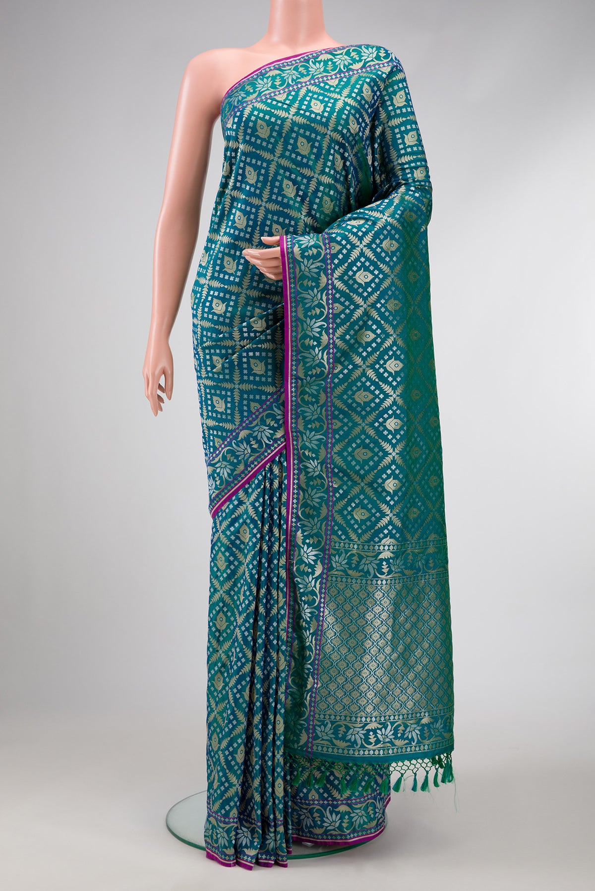 Peacock Blue Dual Tone Blended Banarasi Silk Saree with Zari Brocade on the body and Zari Border.  displayed on a mannequin