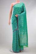 Sea Green Dual Tone Blended Banarasi Silk Saree with Zari Brocade on the body and Zari Border.  displayed on a mannequin