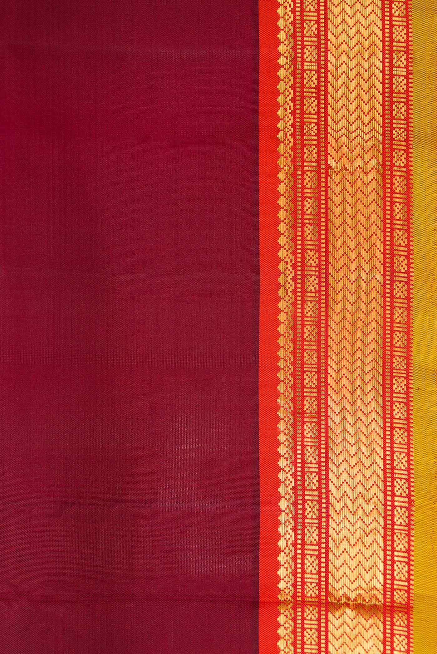 Border image of Maroon Dual Tone Kanjivaram Silk Saree with Plain Body and Zari Border. 