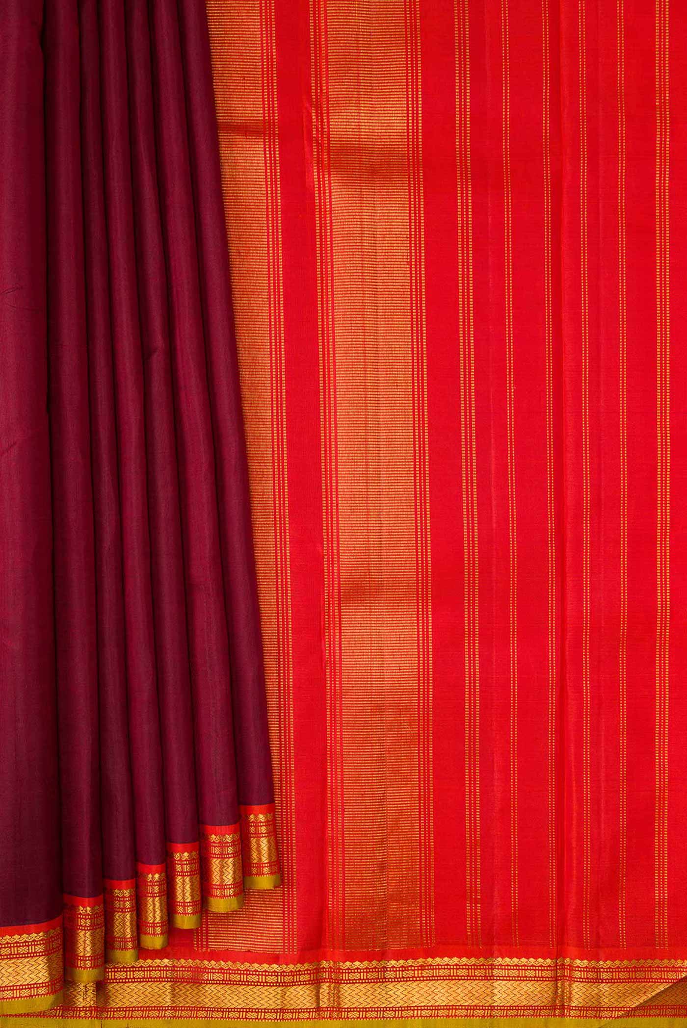 Pleats and pallu of Maroon Dual Tone Kanjivaram Silk Saree with Plain Body and Zari Border. 