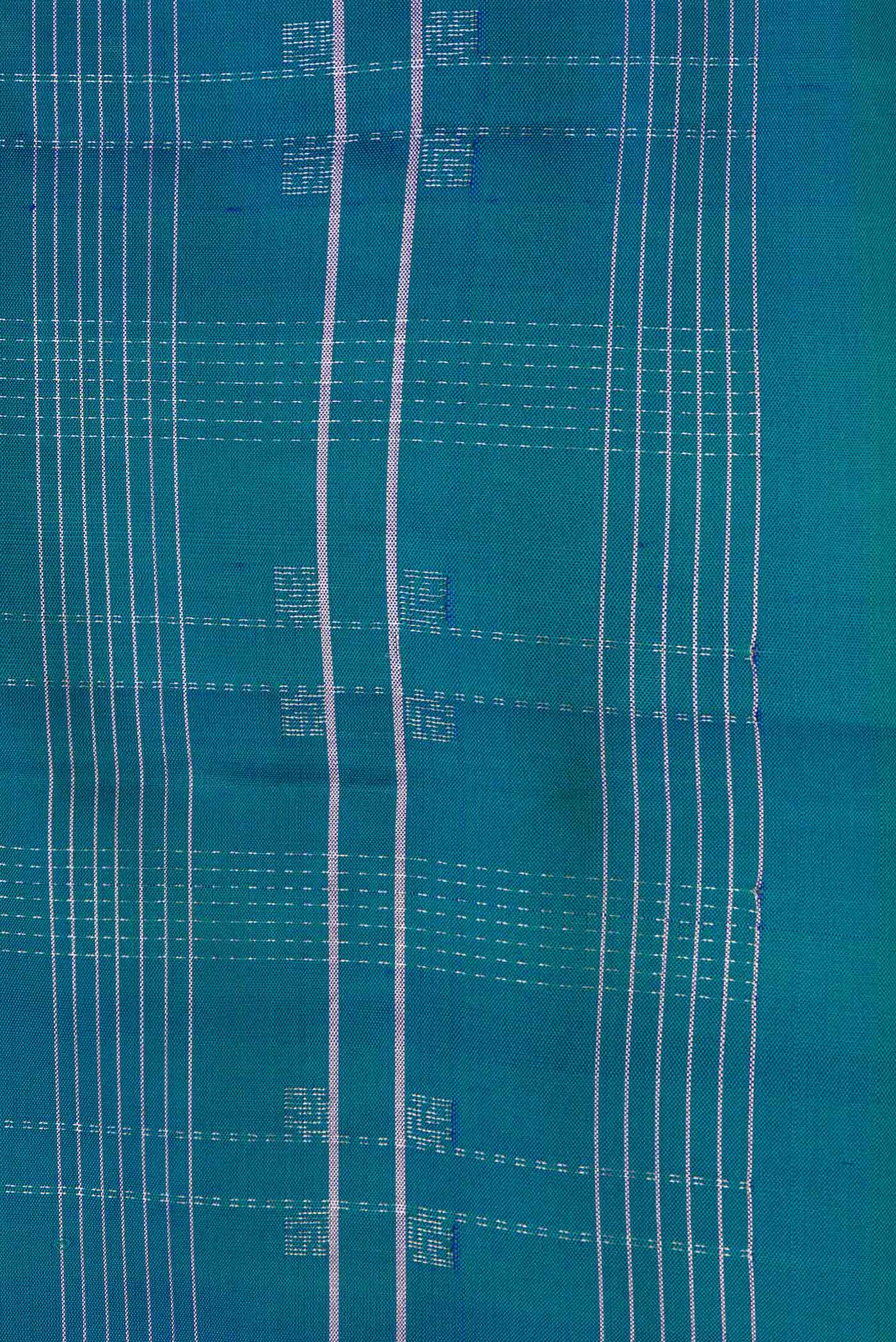 Border image of Peacock Blue Dual Tone Soft Silk Saree with Checked design on the body and Without Border. 