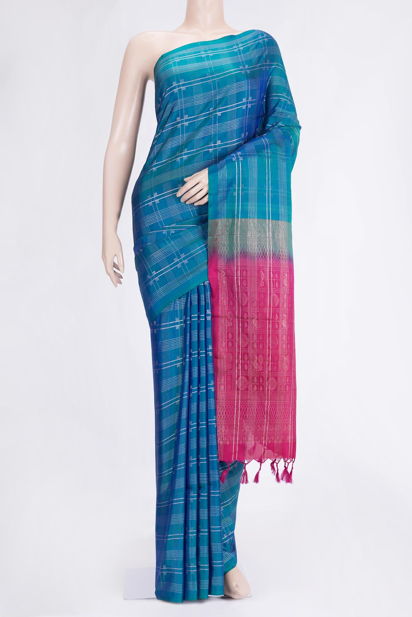 Peacock Blue Dual Tone Soft Silk Saree with Checked design on the body and Without Border.  displayed on a mannequin