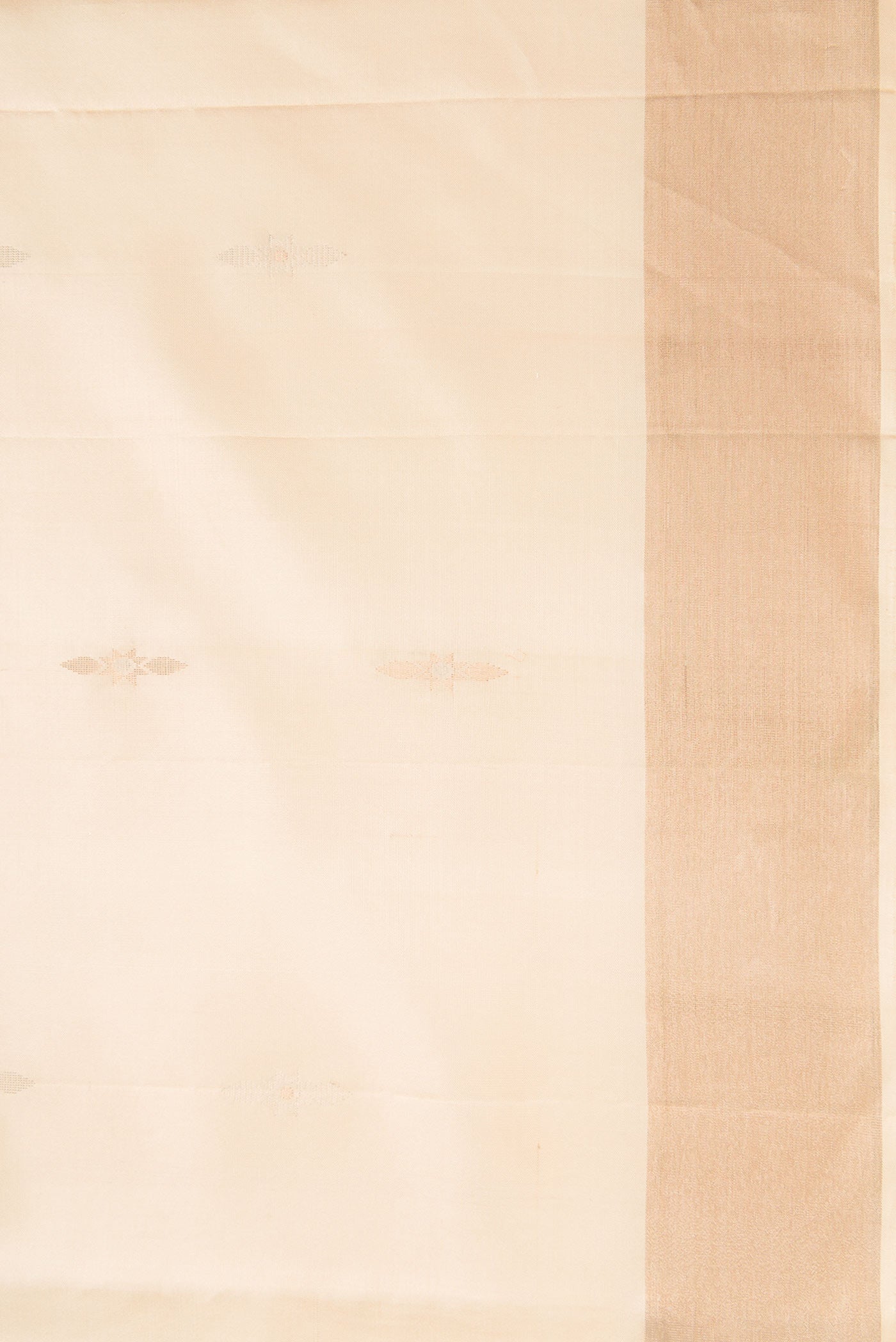 Border image of Beige Dual Tone Soft Silk Saree with Zari Butta on the body and Zari Border. 