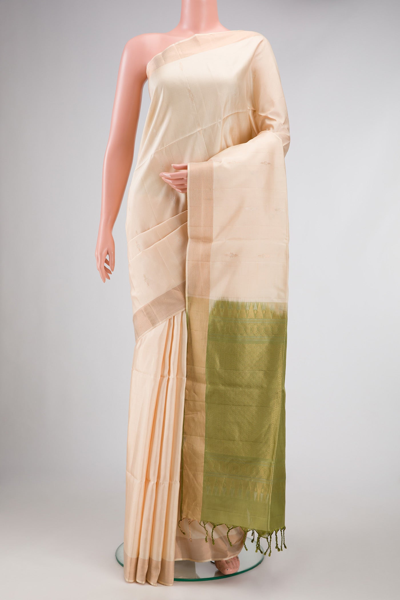 Beige Dual Tone Soft Silk Saree with Zari Butta on the body and Zari Border.  displayed on a mannequin
