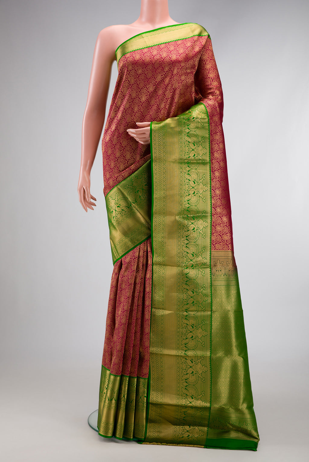 Maroon Dual Tone Kanjivaram Silk Saree with Zari Brocade on the body and Zari Border.  displayed on a mannequin