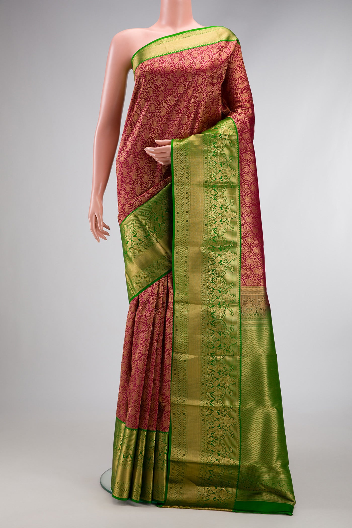 Maroon Dual Tone Kanjivaram Silk Saree with Zari Brocade on the body and Zari Border.  displayed on a mannequin