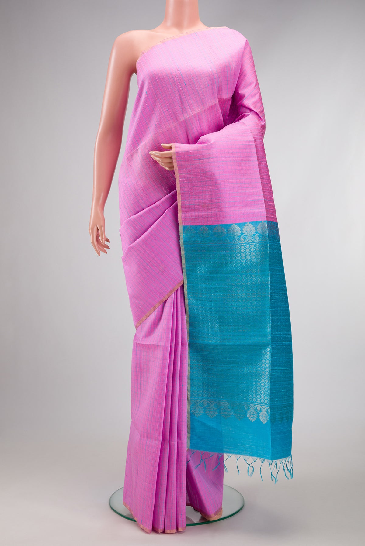 Rose pink Raw Silk Saree with Checked design on the body and Zari Border.  displayed on a mannequin