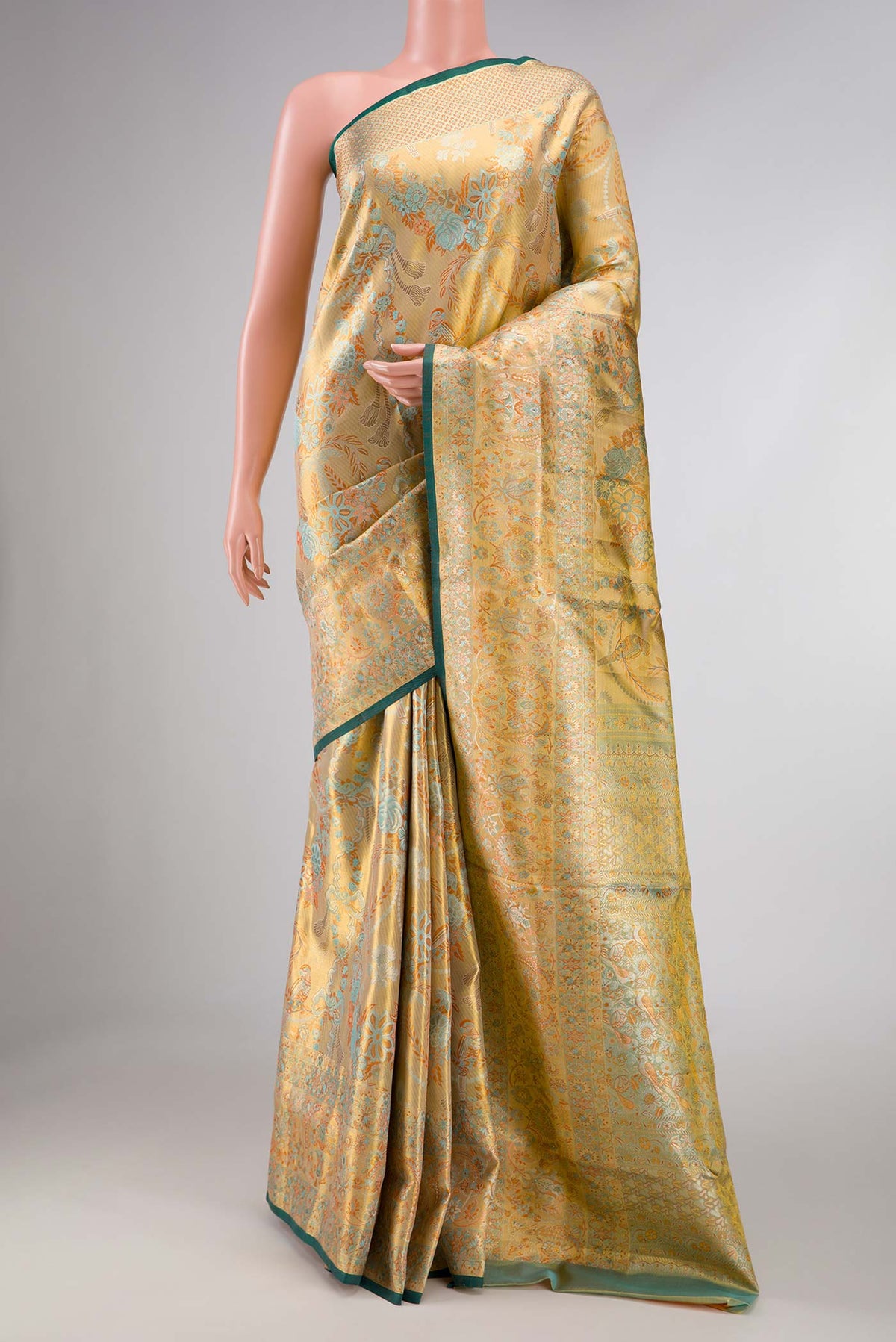 Gold Dual Tone Kanchipuram Tissue Silk Saree with Zari Brocade on the body and Zari Border displayed on a mannequin
