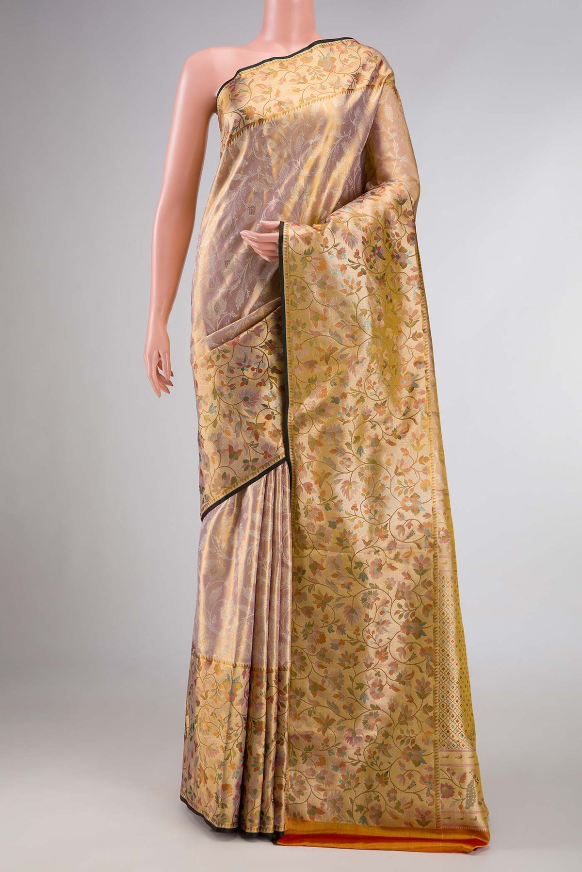 Sandel with Gold Color Kanchipuram Tissue Silk Saree with Zari Brocade on the body and Zari Border displayed on a mannequin