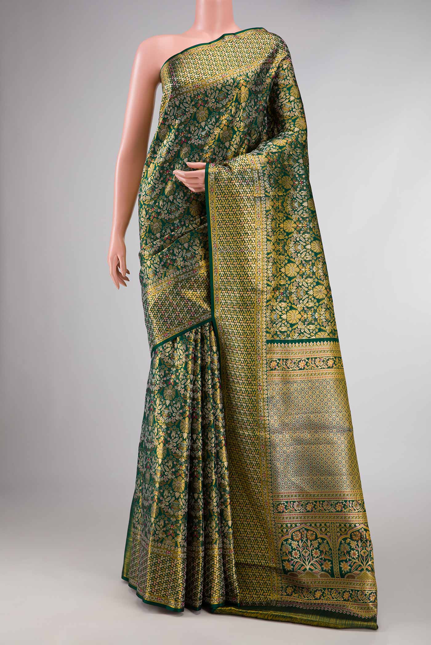Green Dual Tone Kanchipuram Tissue Silk Saree with Zari Brocade on the body and Zari Border displayed on a mannequin