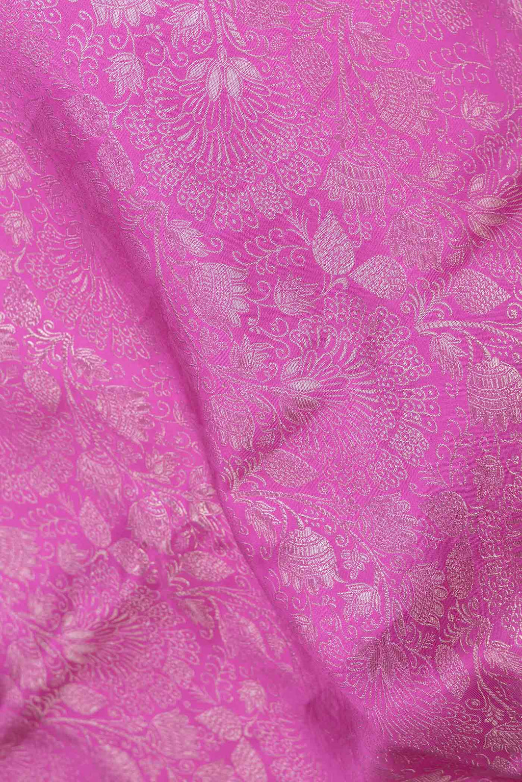 Close up of Magenta Dual Tone Kanchipuram Saree with Zari Brocade on the body and Zari Border displaying folds
