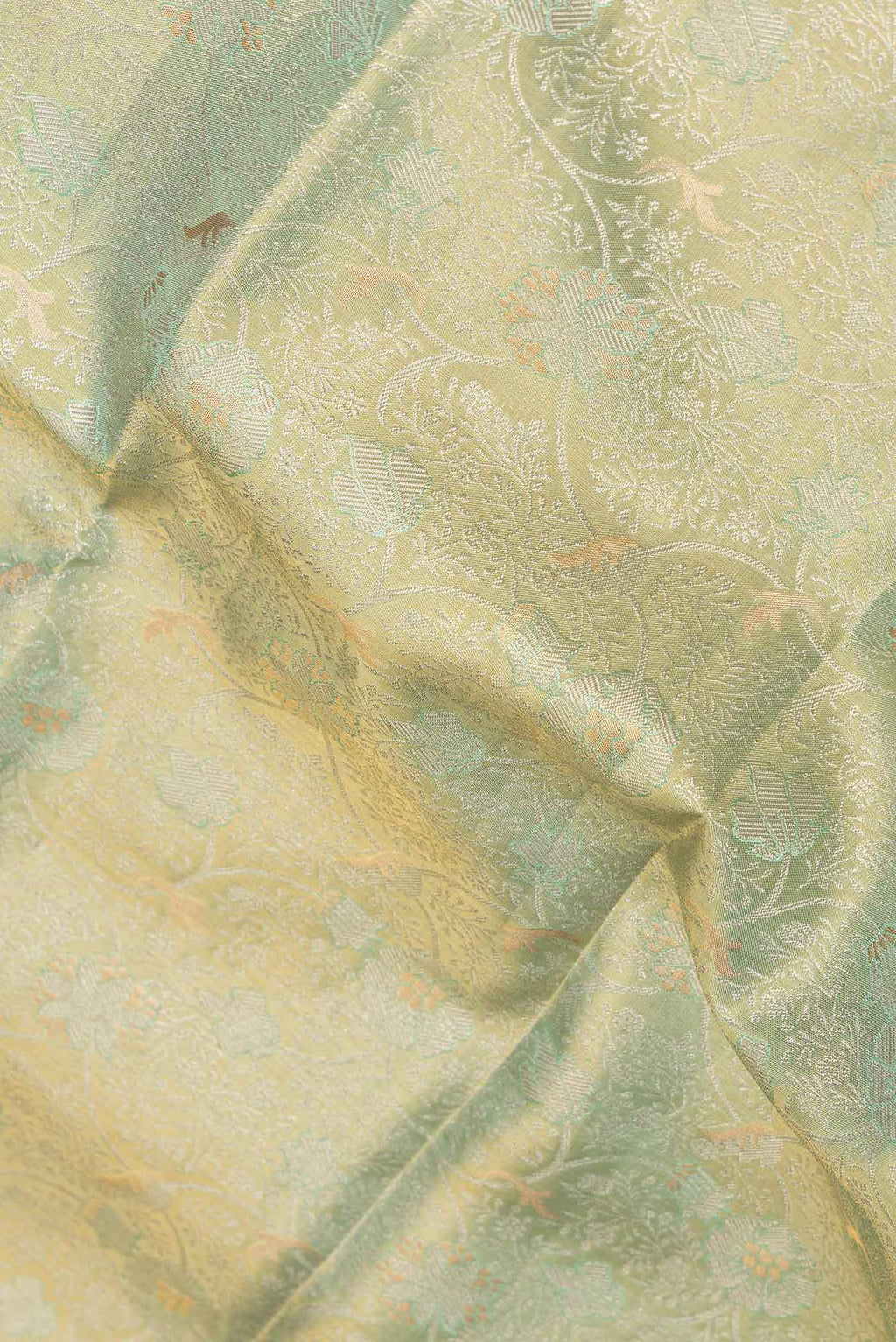 Close up of Pista Green Dual Tone Kanchipuram Saree with Zari Brocade on the body and Zari Border displaying folds