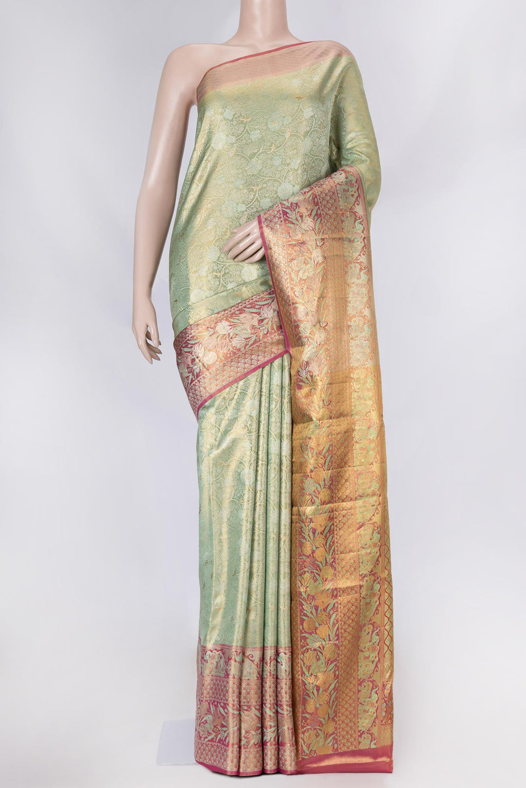 Pista Green Dual Tone Kanchipuram Saree with Zari Brocade on the body and Zari Border displayed on a mannequin