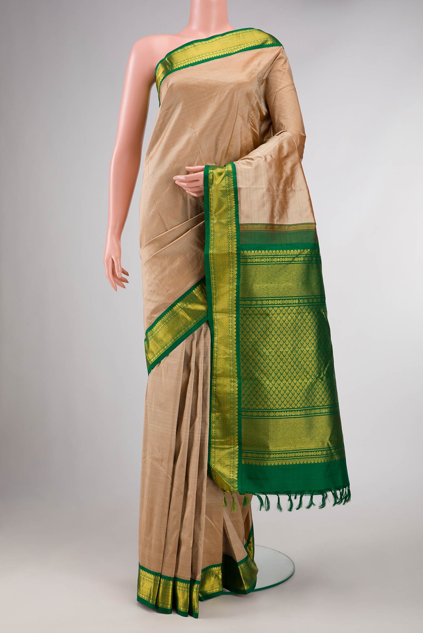 Dark Beige Dual Tone Kanchipuram Silk Saree with Plain Body and Zari Border displayed on a mannequin