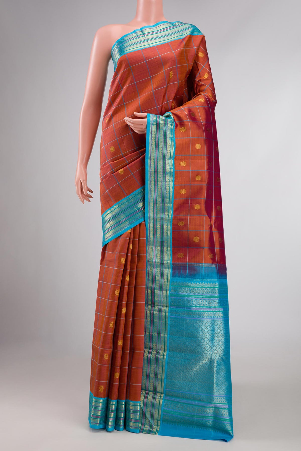 Maroon Dual Tone Kanchipuram Silk Saree with Checked design on the body and Zari Border displayed on a mannequin