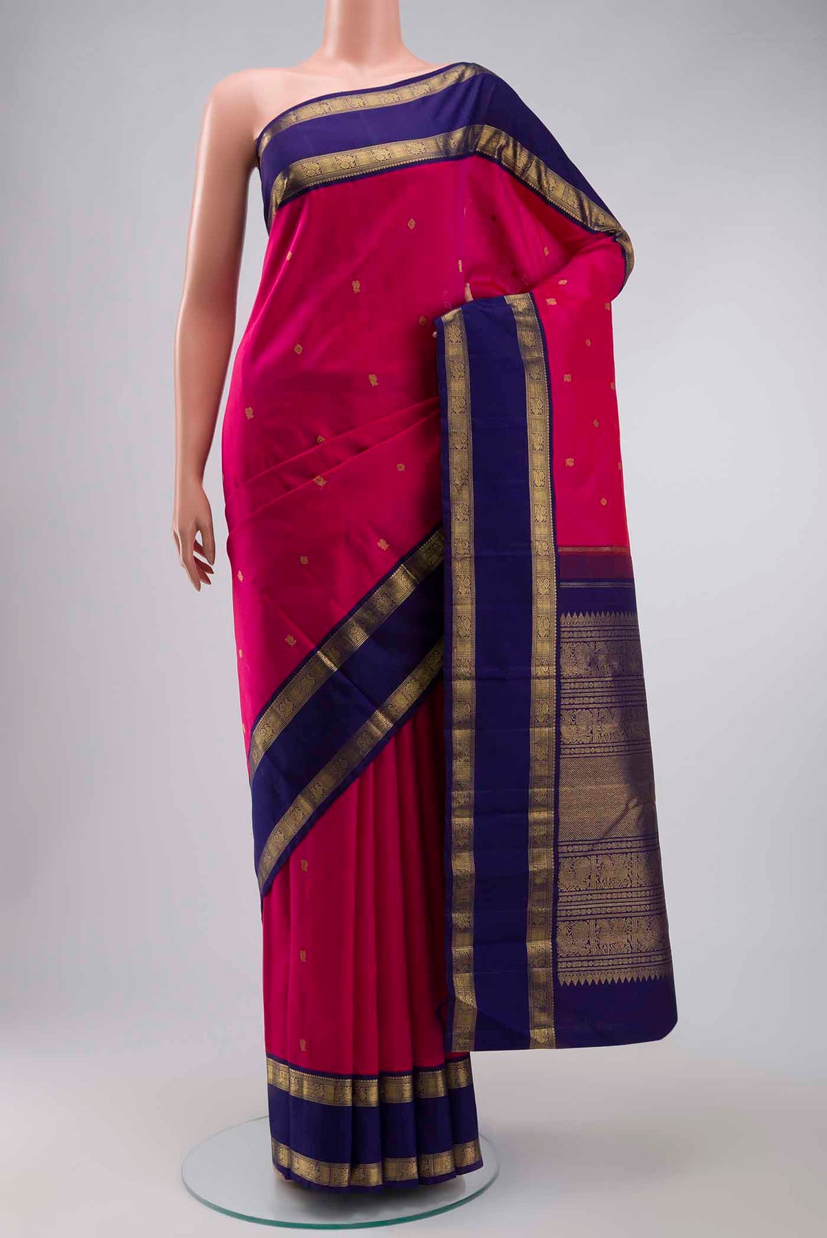 Pink Kanchipuram Silk Saree with Zari Butta on the body and Zari Border displayed on a mannequin
