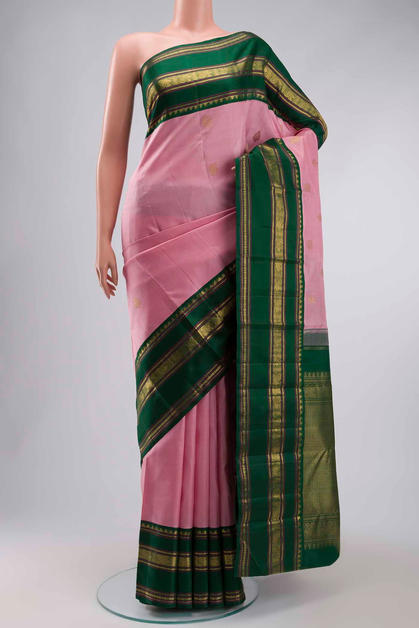 Pink Kanchipuram Silk Saree with Zari Butta on the body and Zari Border displayed on a mannequin