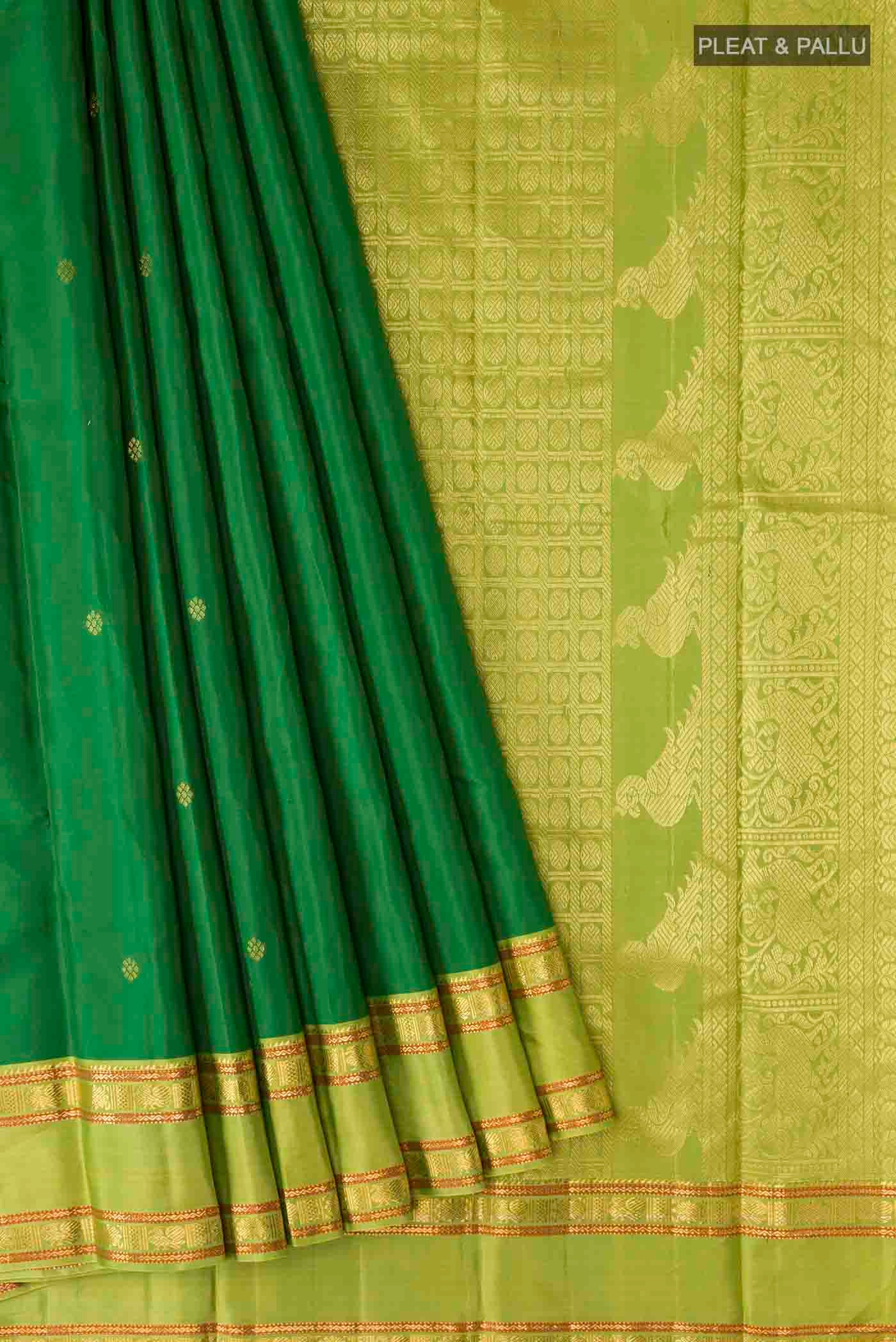 Pleats and pallu of Green Kanchipuram Silk Saree with Zari Butta on the body and Zari Border