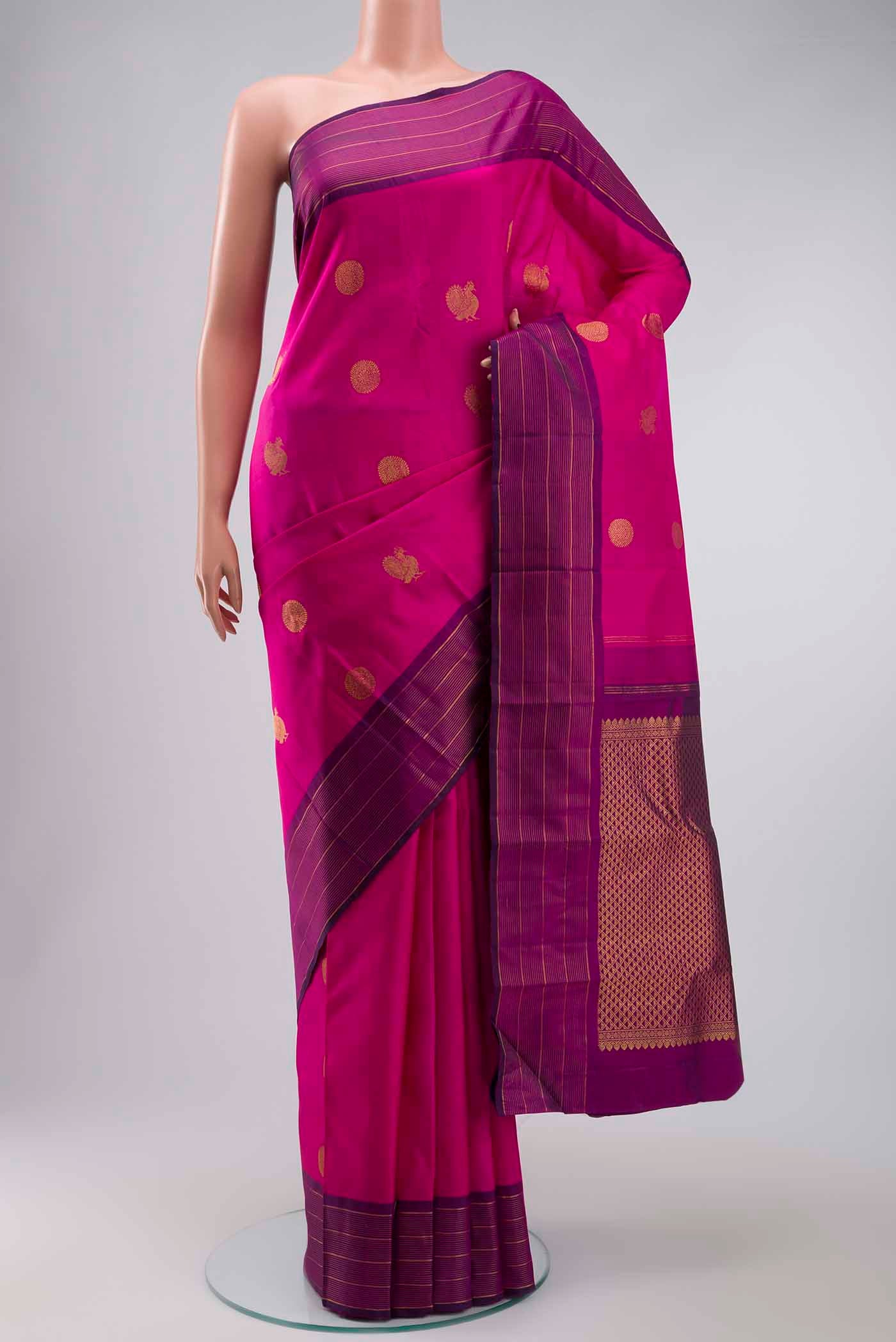Pink Kanchipuram Silk Saree with Zari Butta on the body and Zari Border displayed on a mannequin