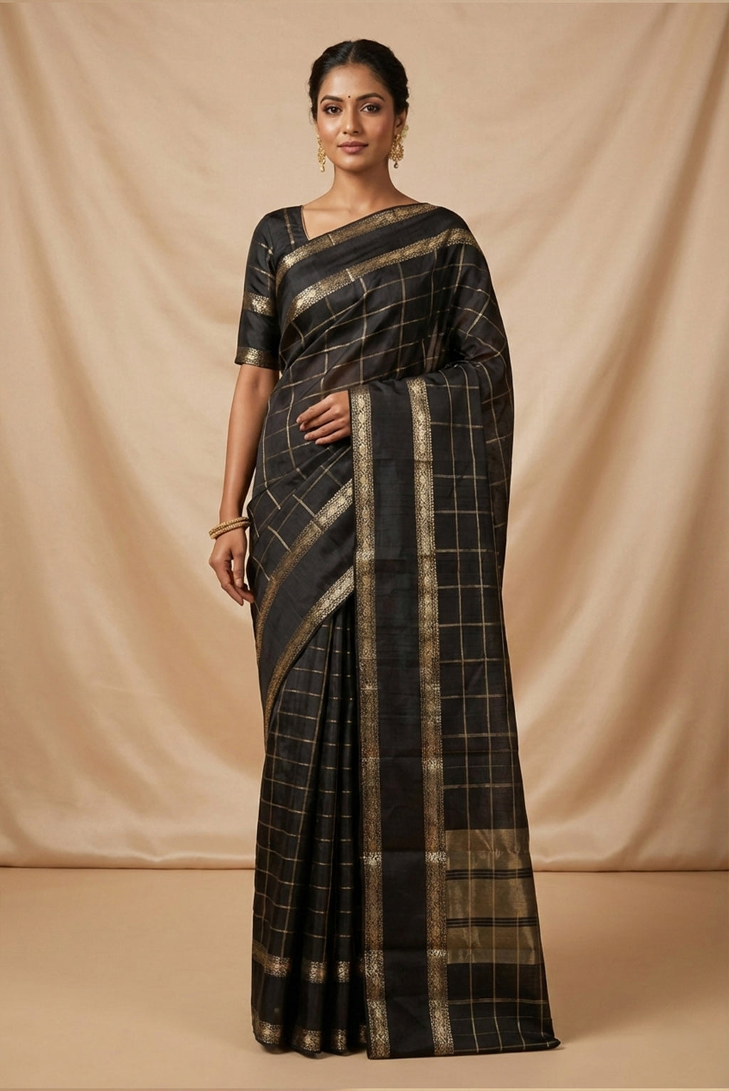Model wearing a Black Dual Tone Kanchipuram Silk Saree with Checked design on the body and Zari Border