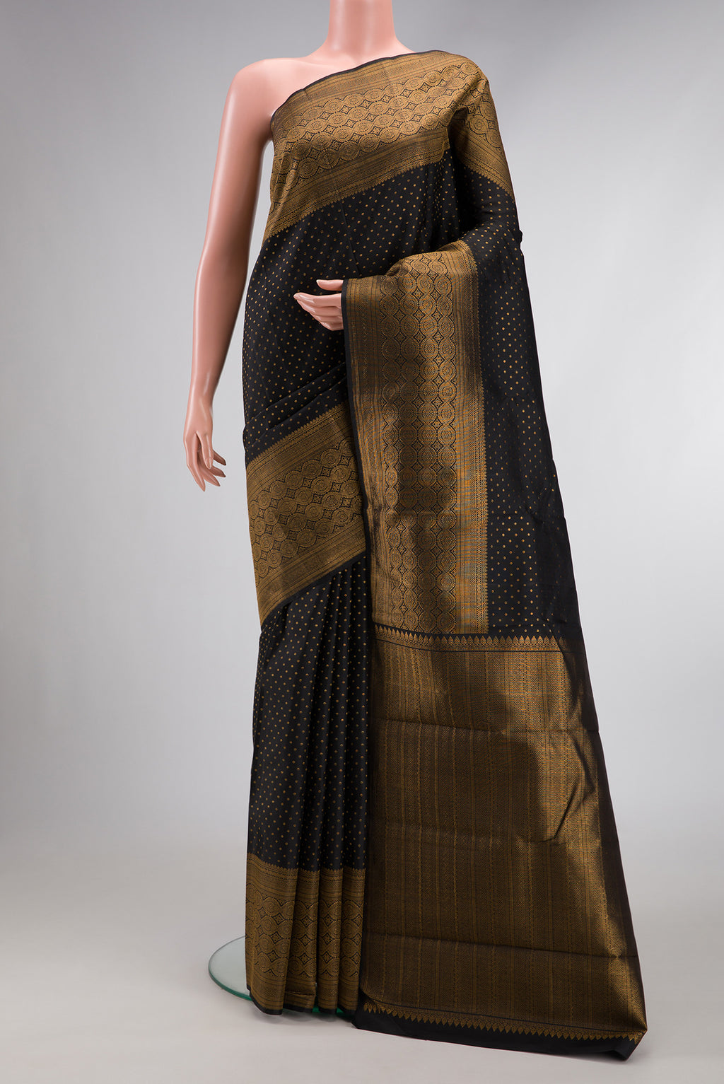 Pure Silk Pure Zari Black Dual Tone Kanjivaram Saree with Zari Butta on the body and Fancy Border.  displayed on a mannequin