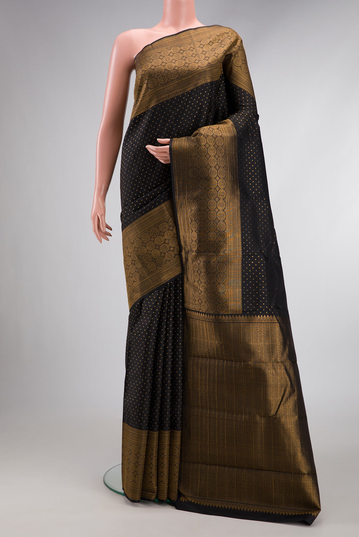 Pure Silk Pure Zari Black Dual Tone Kanjivaram Saree with Zari Butta on the body and Fancy Border.  displayed on a mannequin