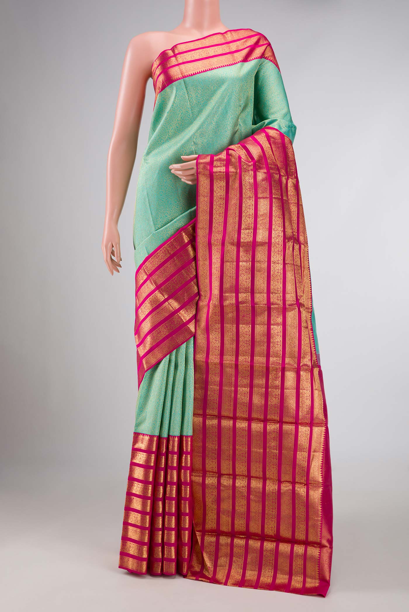 Pure Silk Pure Zari Sea Green Dual Tone Kanchipuram Saree with Zari Brocade on the body and Zari Border displayed on a mannequin