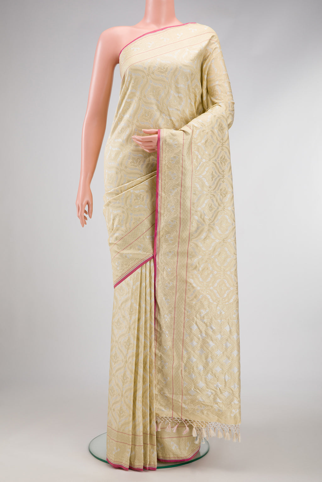 Beige Dual Tone Blended Banarasi Silk Saree with Zari Brocade on the body and Zari Border.  displayed on a mannequin
