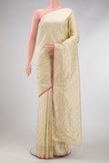 Beige Dual Tone Blended Banarasi Silk Saree with Zari Brocade on the body and Zari Border.  displayed on a mannequin
