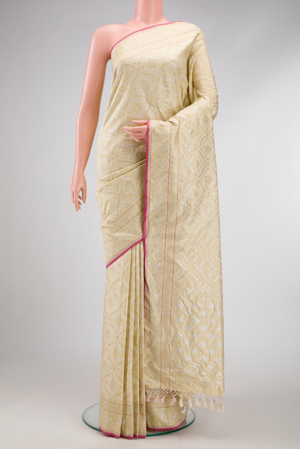 Beige Dual Tone Blended Banarasi Silk Saree with Zari Brocade on the body and Zari Border.  displayed on a mannequin