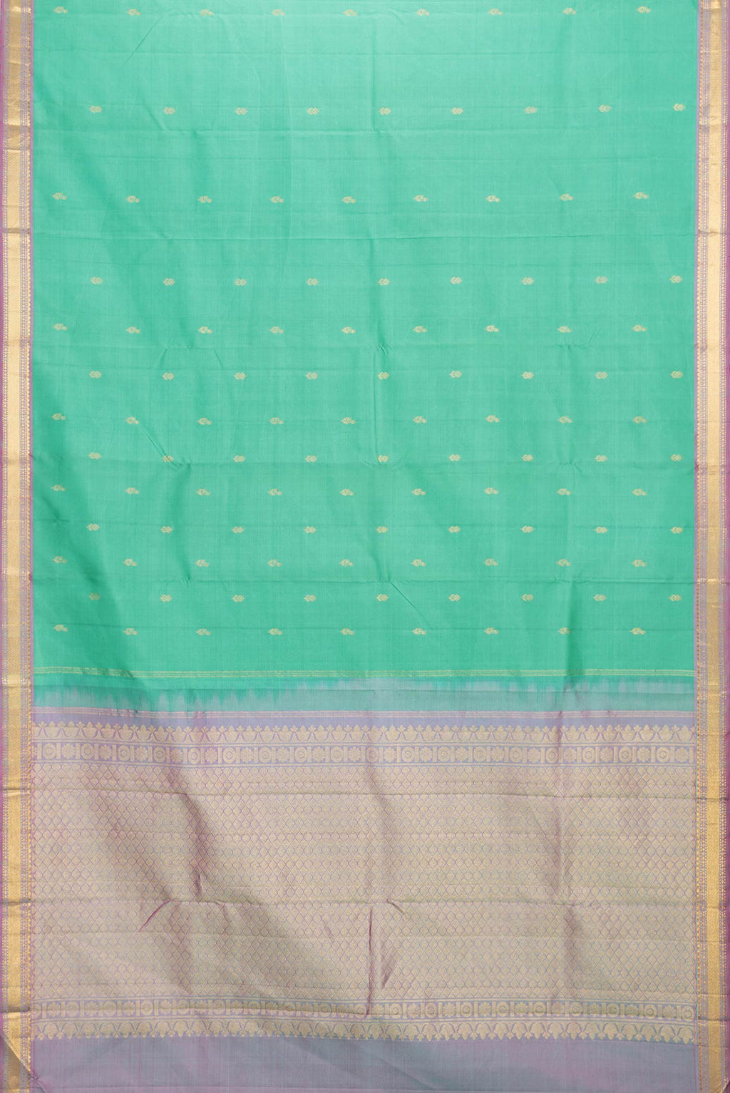 Flat view of Green Dual Tone Kanchipuram Saree with Zari Butta on the body and Zari Border. 