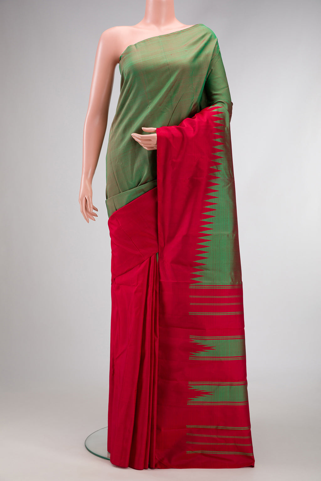 Green Dual Tone Kanchipuram Silk Saree with Plain Body and Temple Border.  displayed on a mannequin