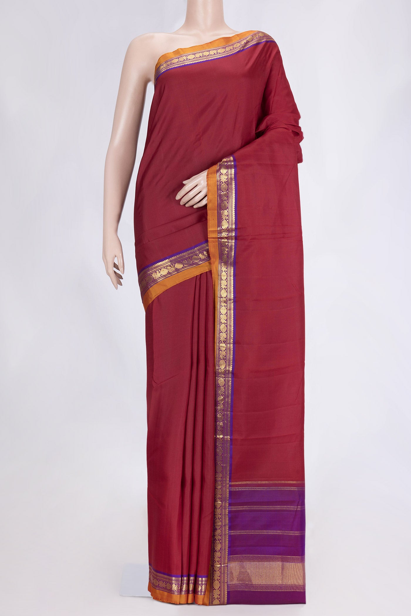 Maroon Dual Tone Kanjivaram Silk Saree with Plain Body and Zari Border.  displayed on a mannequin