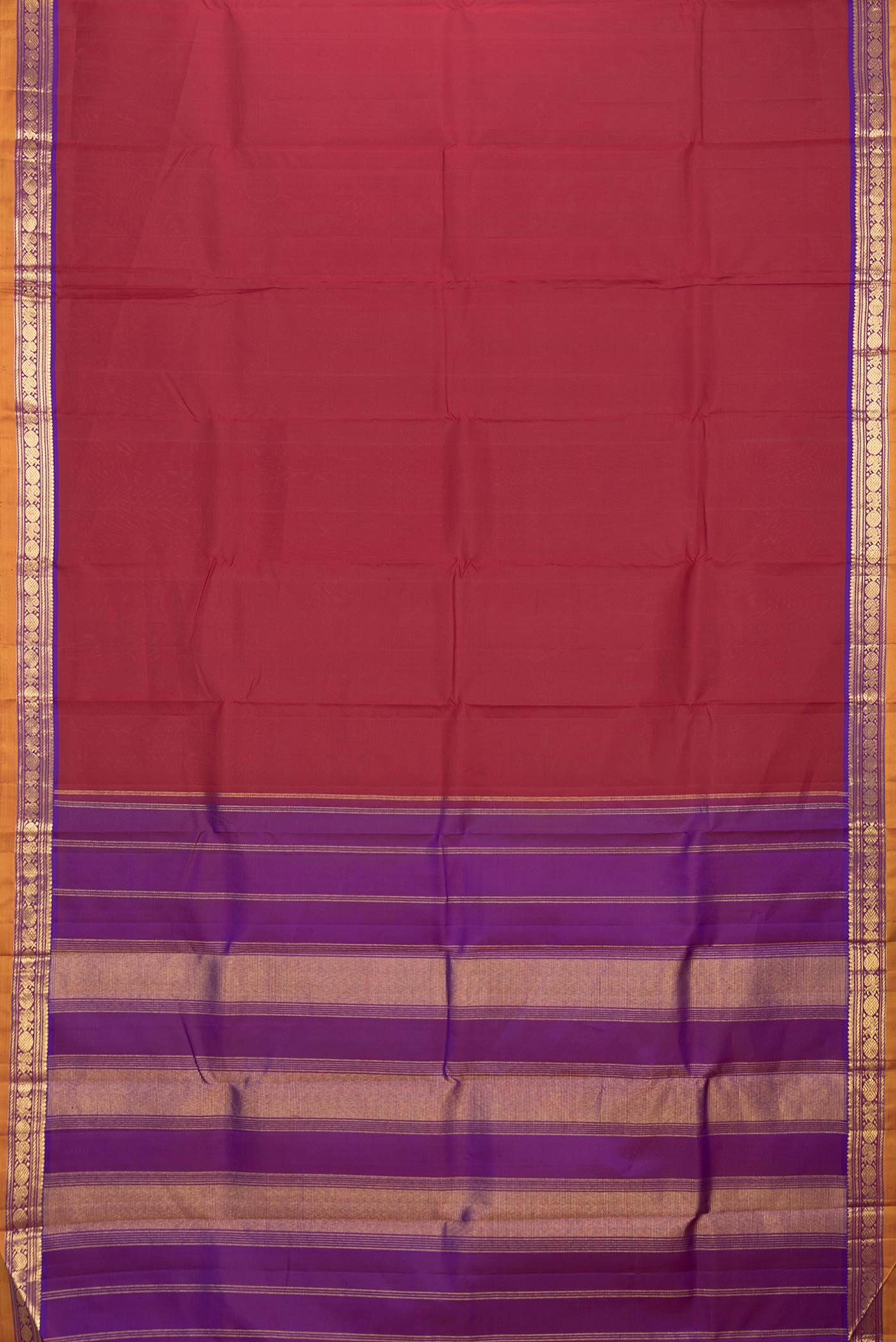 Flat view of Maroon Dual Tone Kanjivaram Silk Saree with Plain Body and Zari Border. 