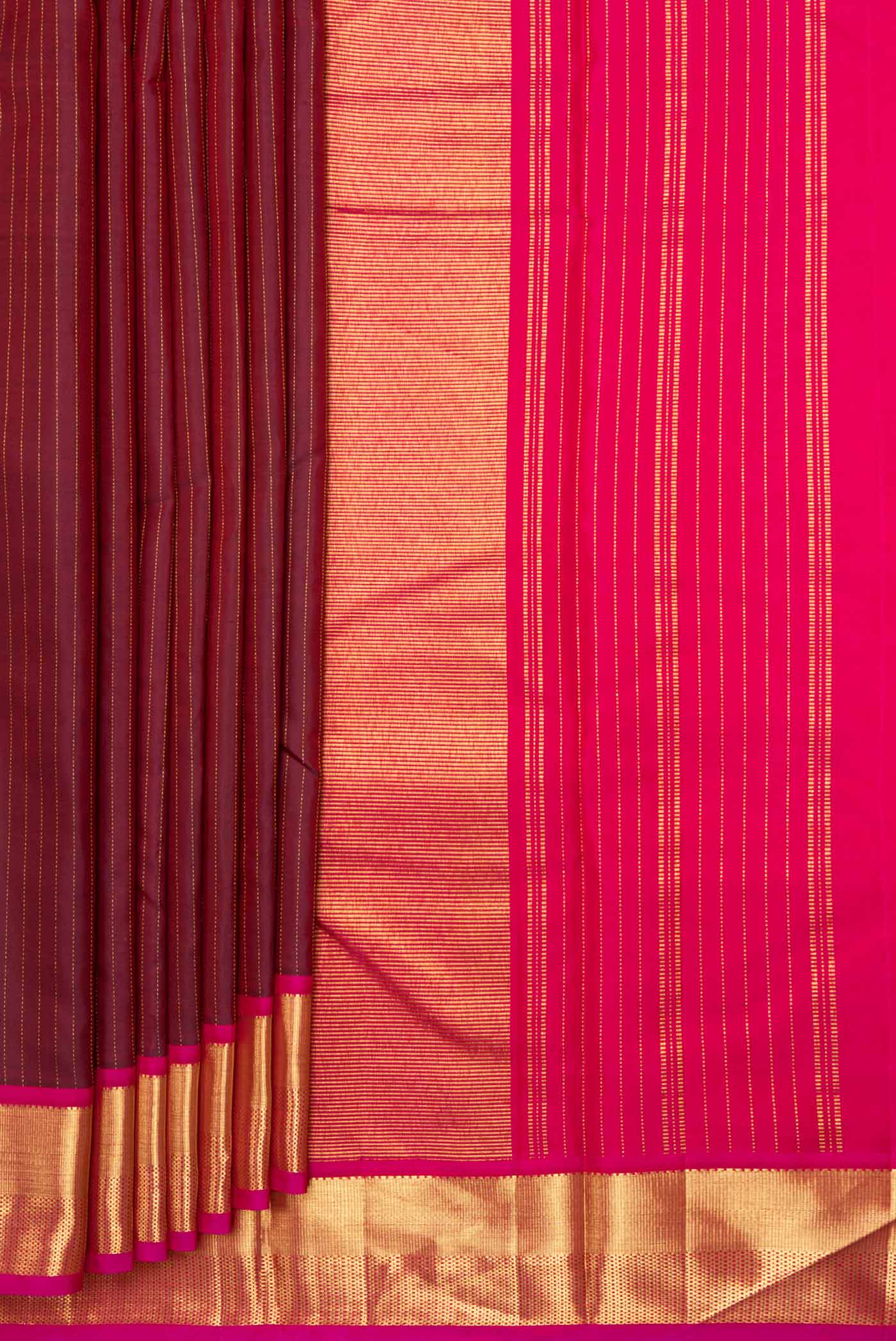 Pleats and pallu of Maroon Dual Tone Kanchipuram Silk Saree with Stripes on the body and Zari Border