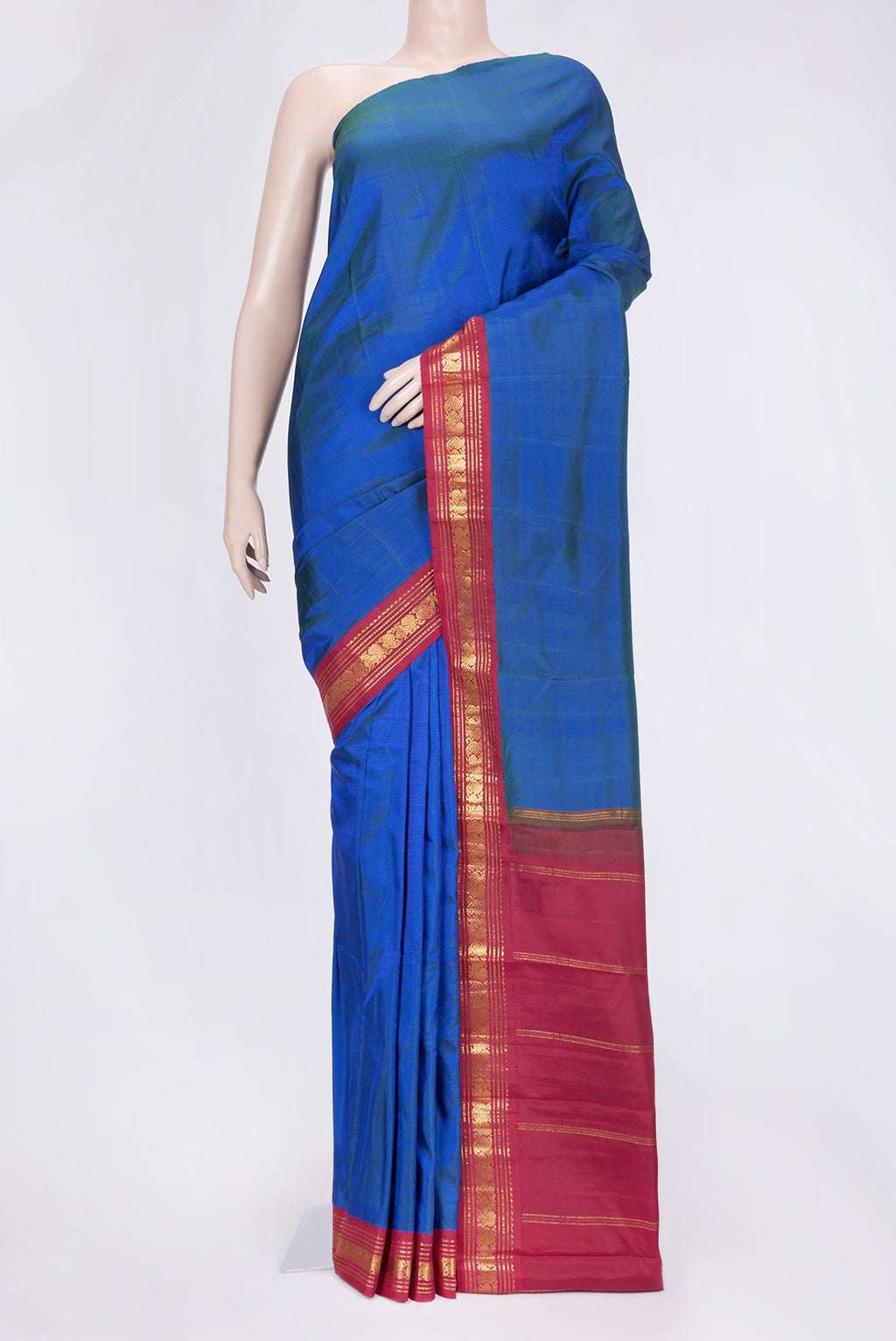 Peacock Blue Dual Tone Kanjivaram Saree with Plain Body and Zari Border.  displayed on a mannequin