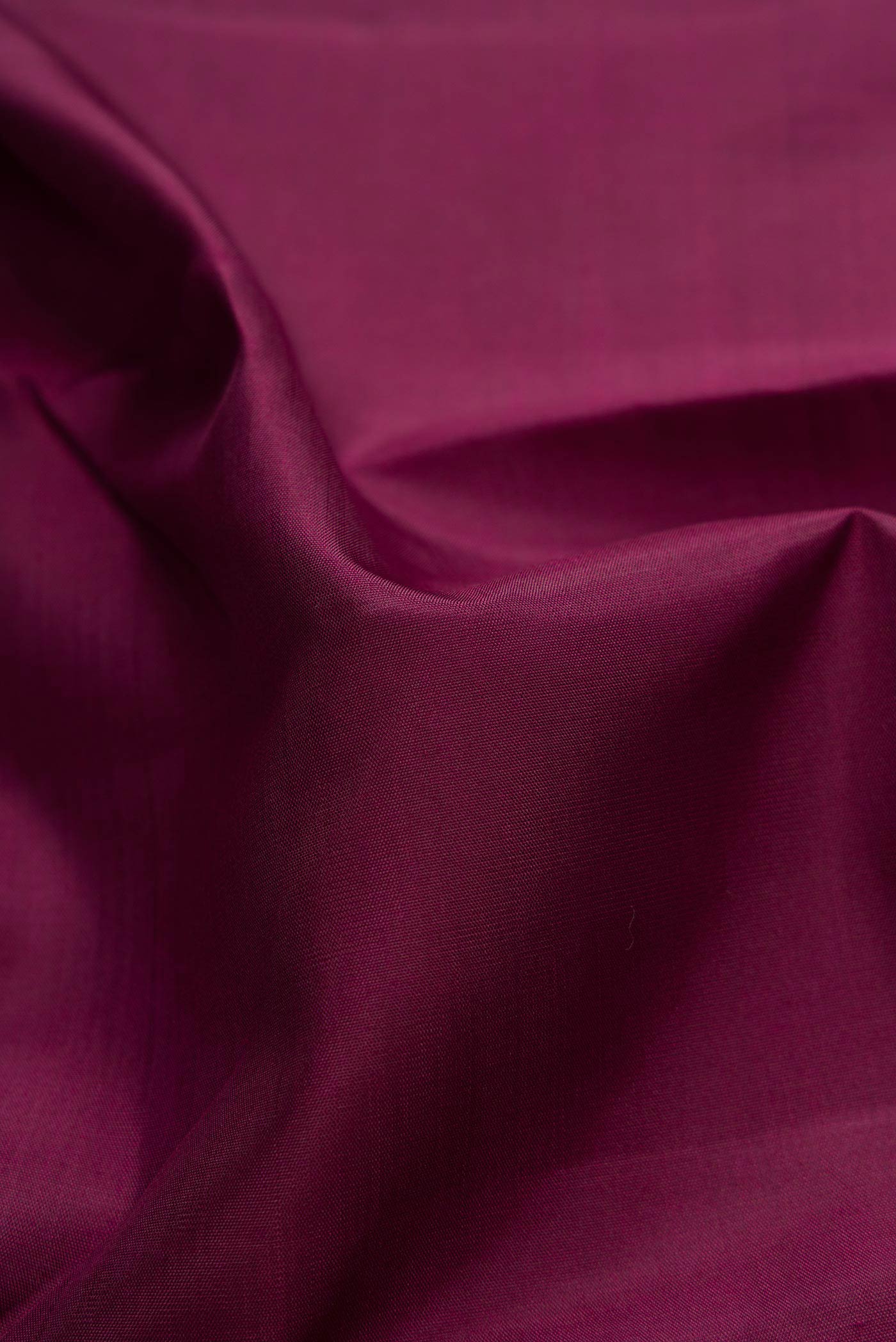 Close up of Pure Silk Pure Zari Maroon Dual Tone Kanchipuram Saree with Plain Body and Zari Border displaying folds