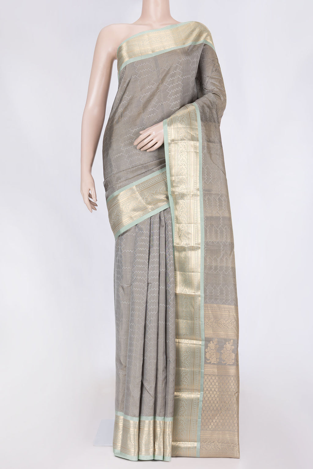 Grey Kanchipuram Silk Saree with Jacquard design on the body and Zari Border displayed on a mannequin