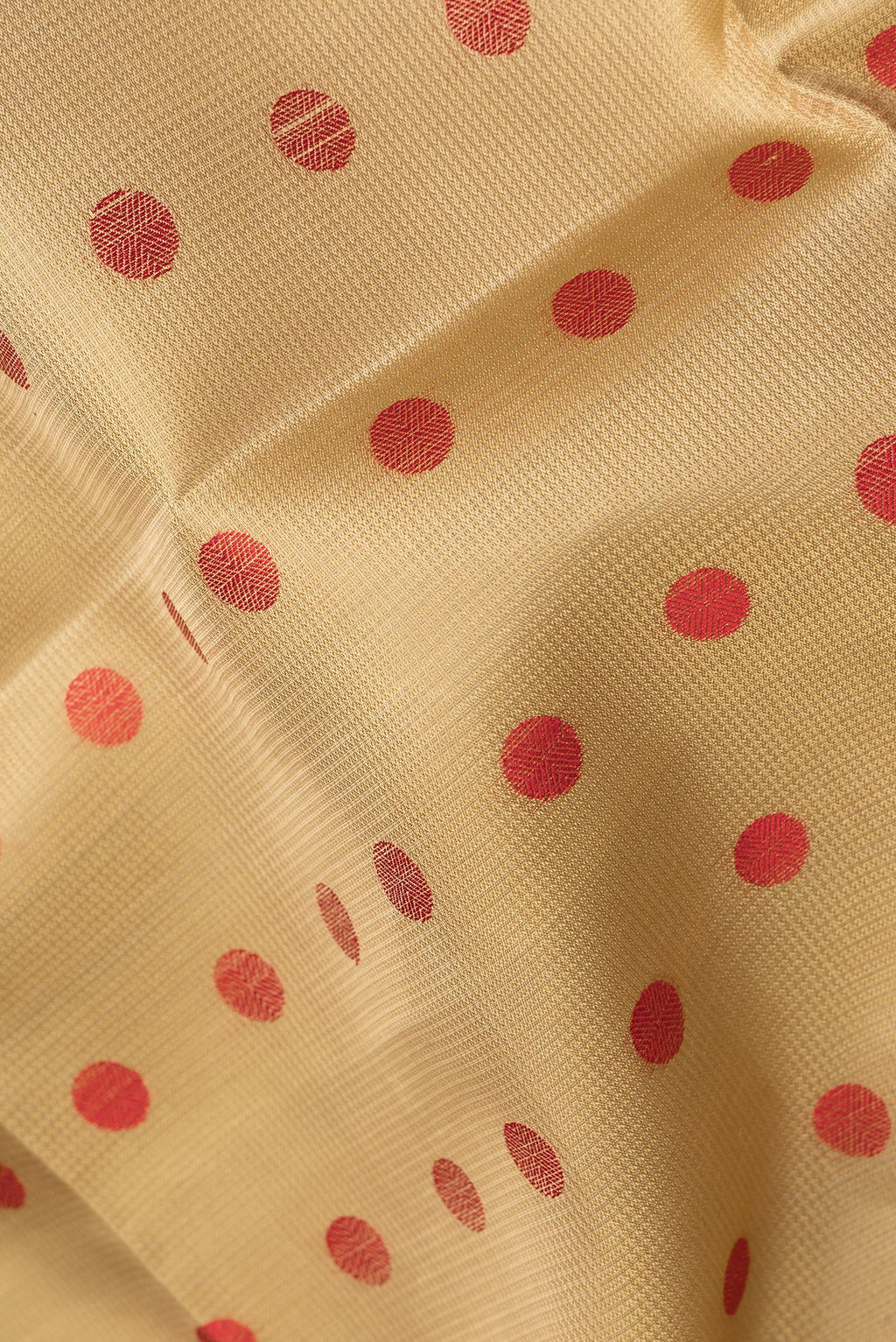 Close up of Pure Silk Beige Dual Tone Soft Saree with Thread Butta on the body and Thread Border.  displaying folds