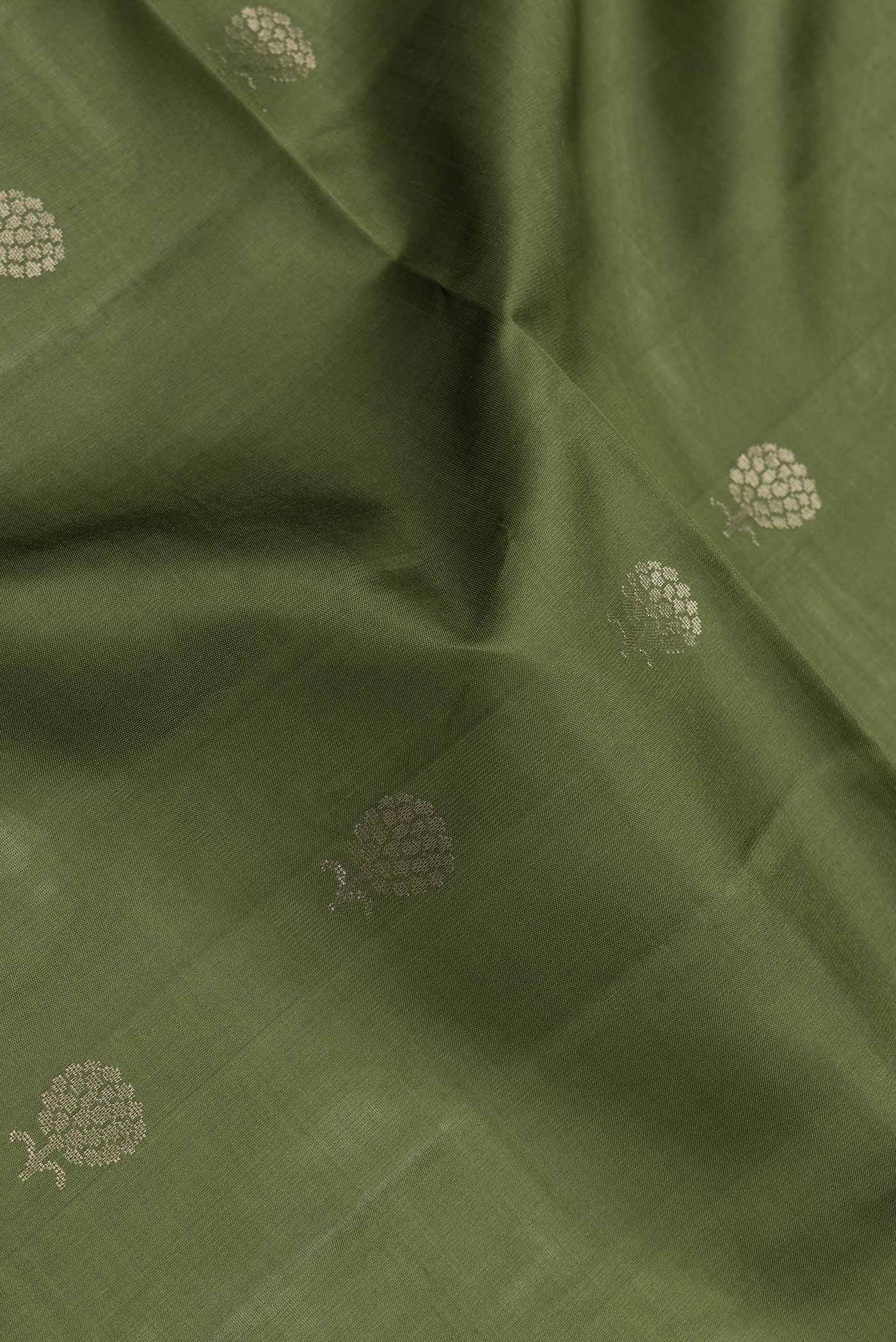 Close up of Mehandi Green Dual Tone Soft Silk Saree with Zari Butta on the body and Zari Border.  displaying folds