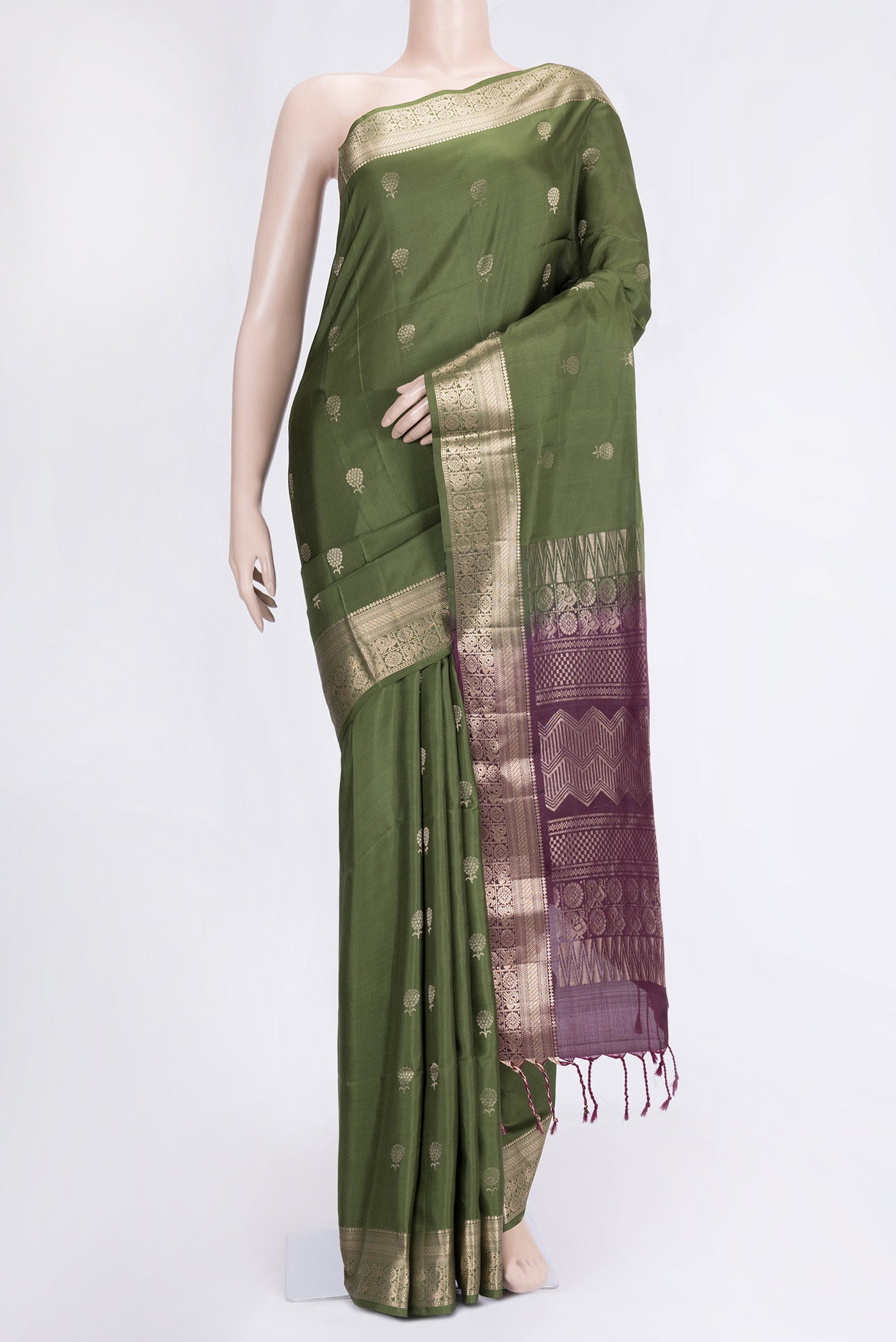 Mehandi Green Dual Tone Soft Silk Saree with Zari Butta on the body and Zari Border.  displayed on a mannequin