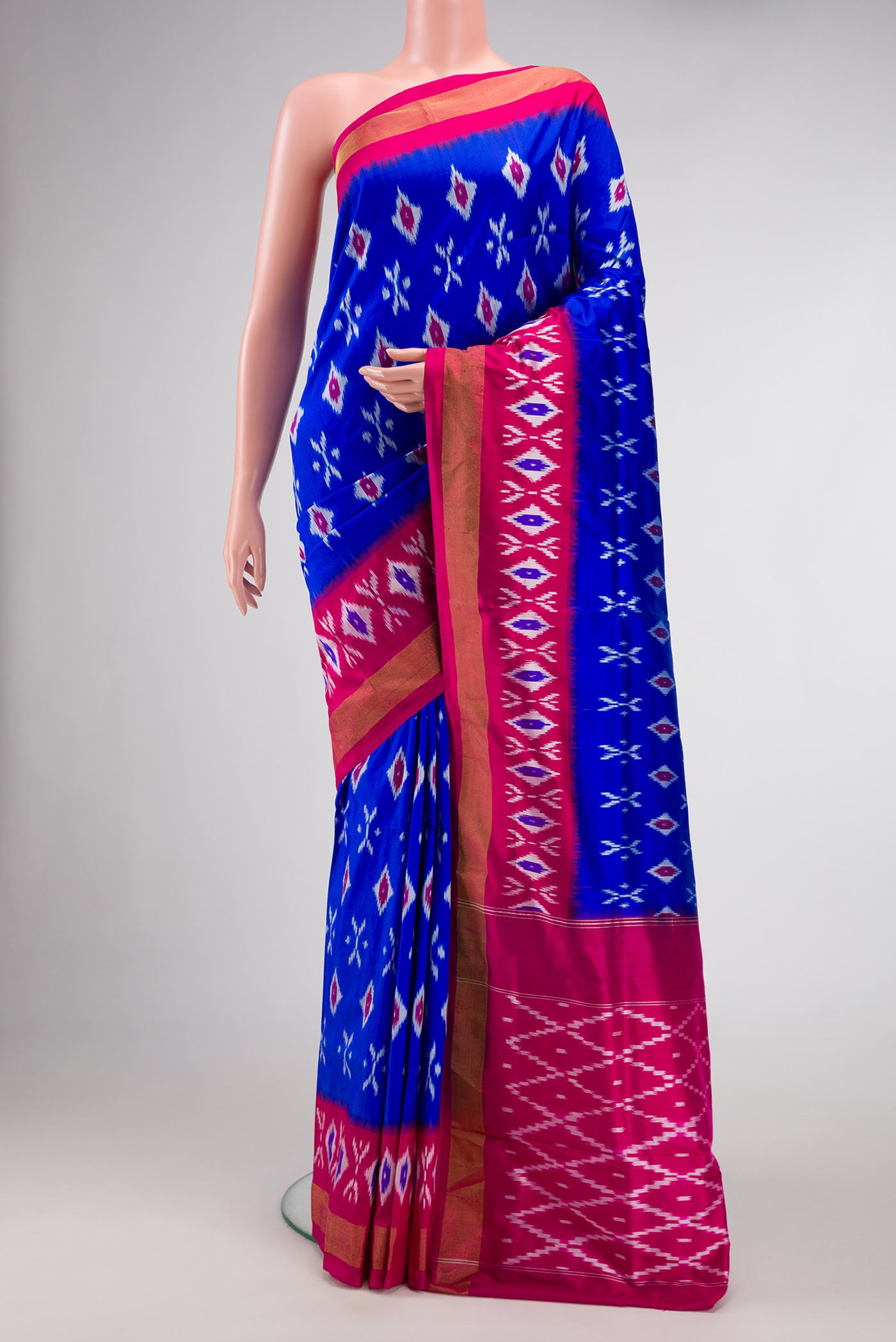 Royal Blue Dual Tone Double Ikat Saree with Ikat Print on the body and Ikat Border.  displayed on a mannequin
