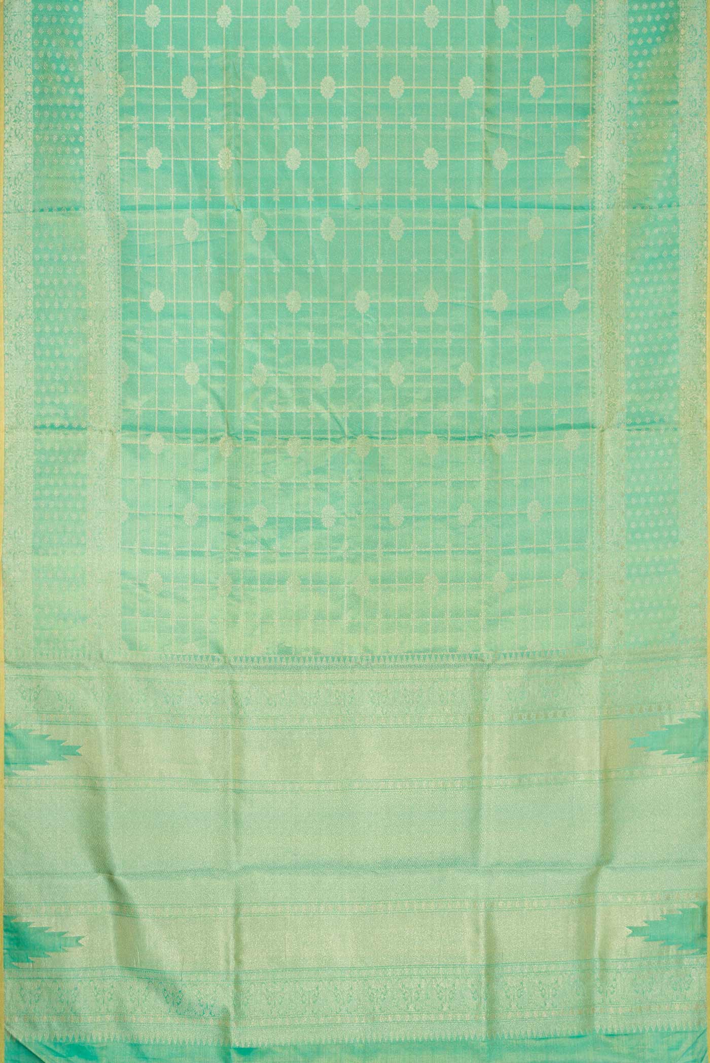 Flat view of Sea Green Dual Tone Kanjivaram Tissue Silk Saree with Zari Brocade on the body and Zari Border. 