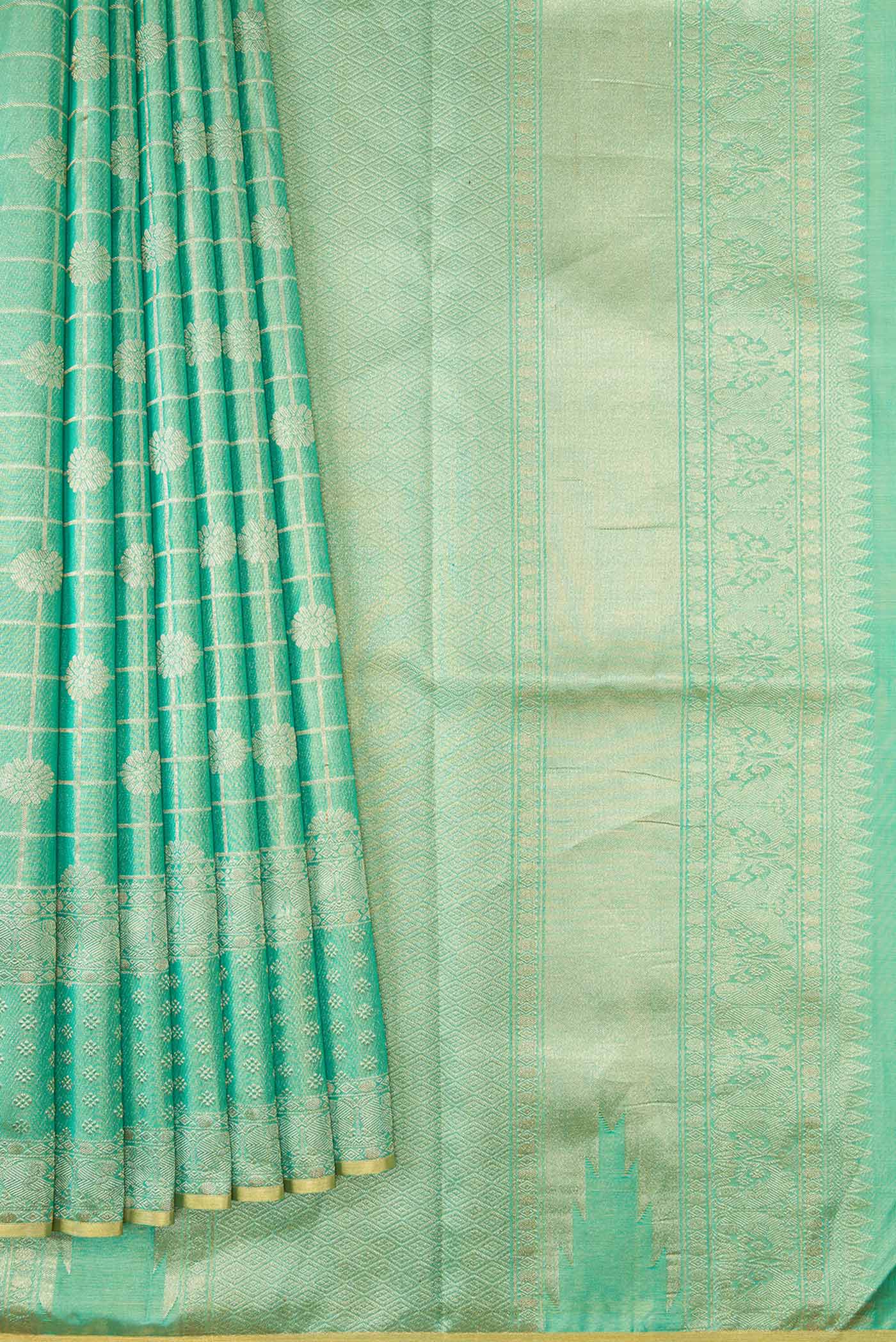 Pleats and pallu of Sea Green Dual Tone Kanjivaram Tissue Silk Saree with Zari Brocade on the body and Zari Border. 