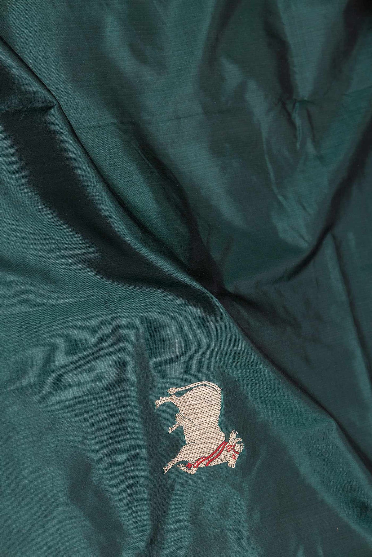 Close up of Blue Banarasi Katan Silk Saree with Zari Butta on the body and Zari Border displaying folds