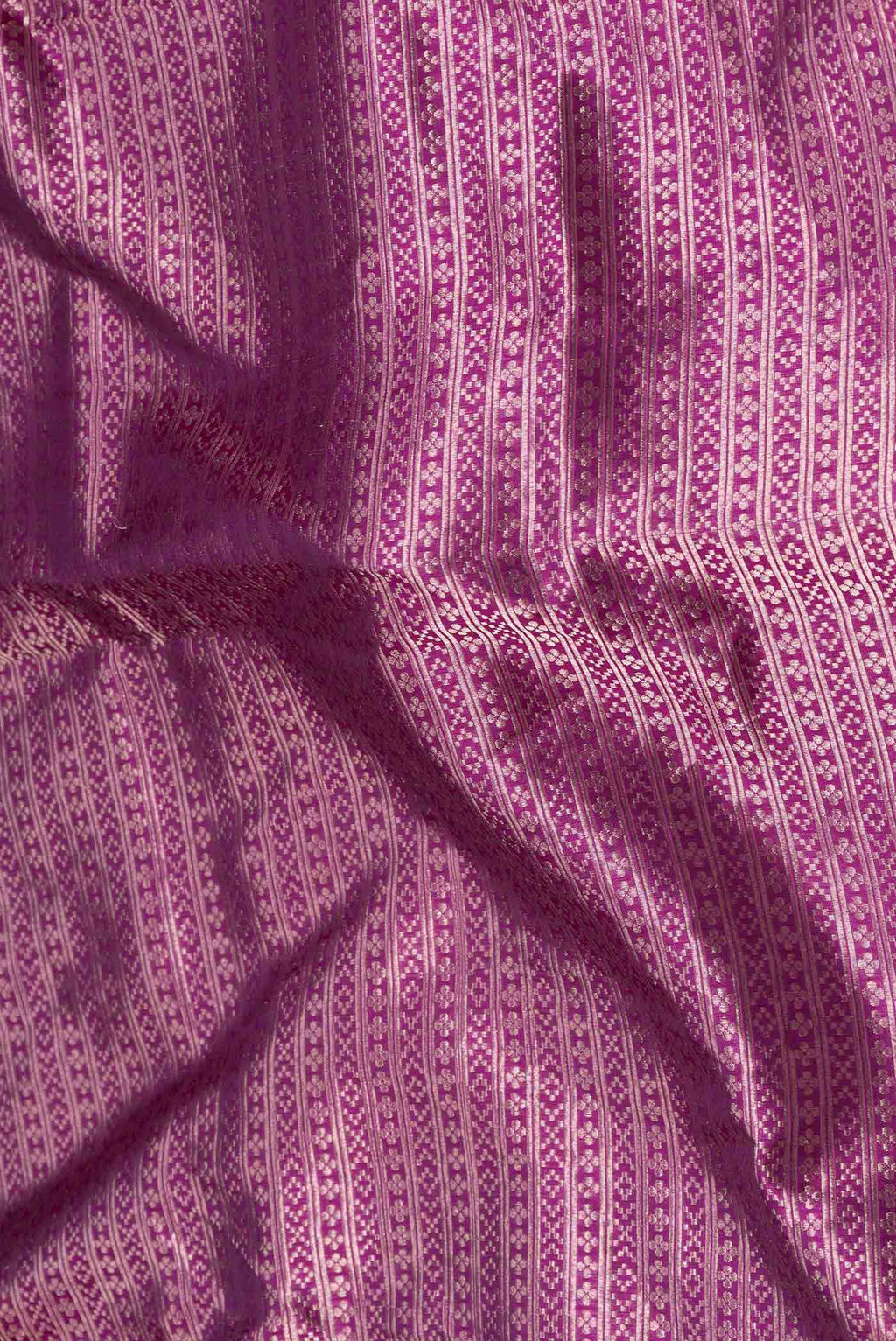 Close up of Violet Banarasi Silk Saree with Zari Brocade on the body and Zari Border displaying folds