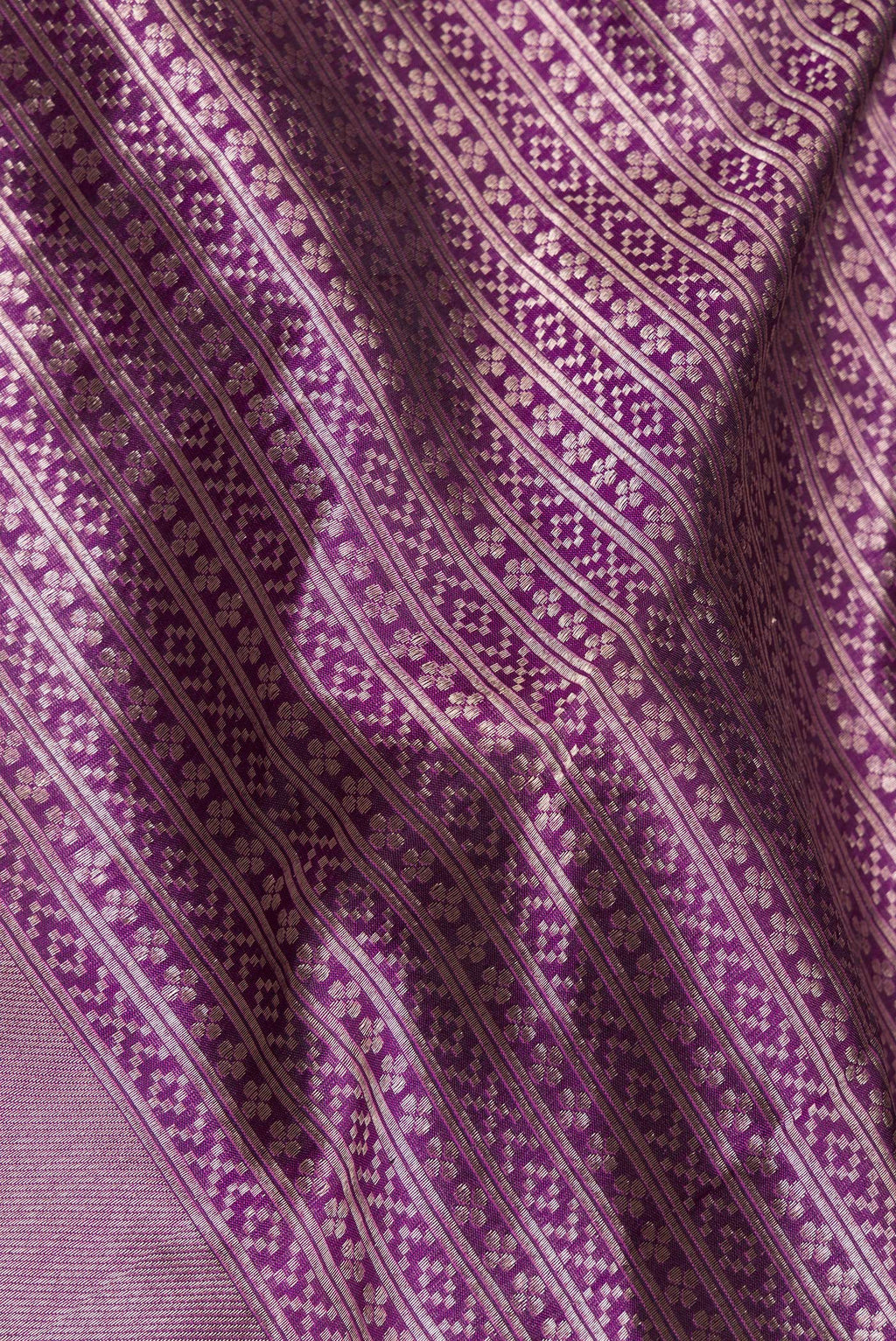 Close up of Pure Silk Magenta Banarasi Saree with Zari Brocade on the body and Zari Border.  displaying folds