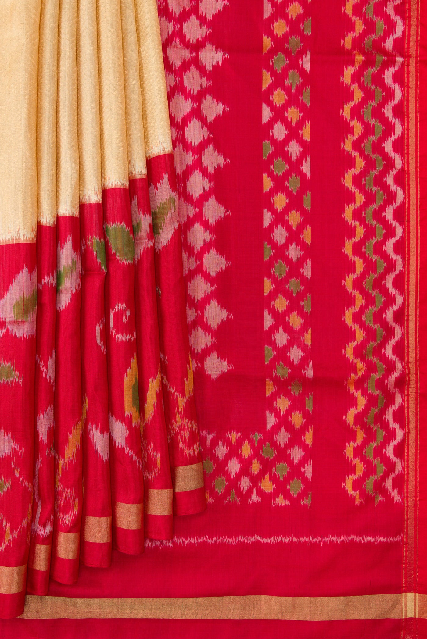 Pleats and pallu of Gold Dual Tone Soft Silk Saree with Zari Brocade on the body and Ikat Border. 