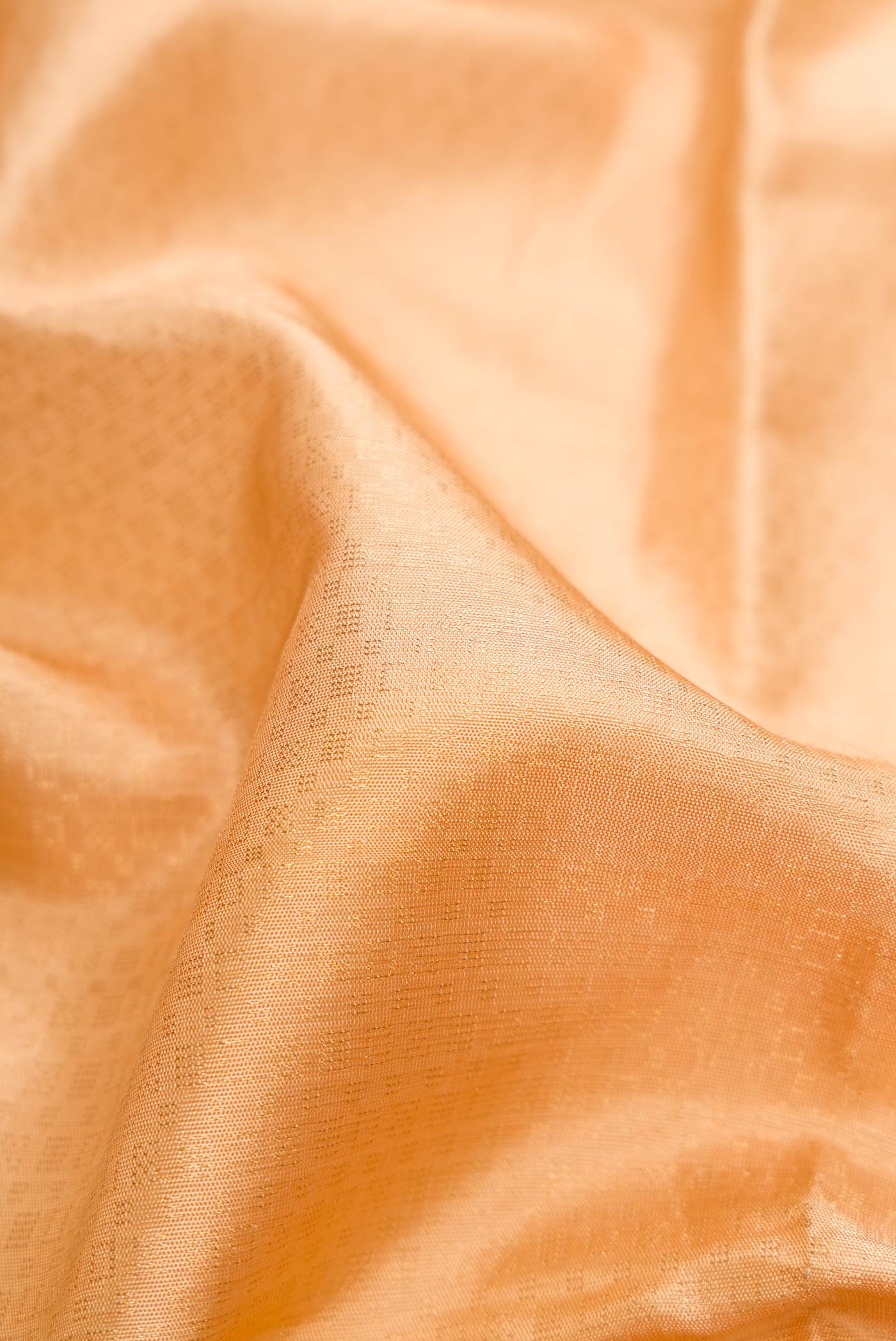 Close up of Sandal Dual Tone Soft Silk Saree with Zari Brocade on the body and Ikat Border.  displaying folds