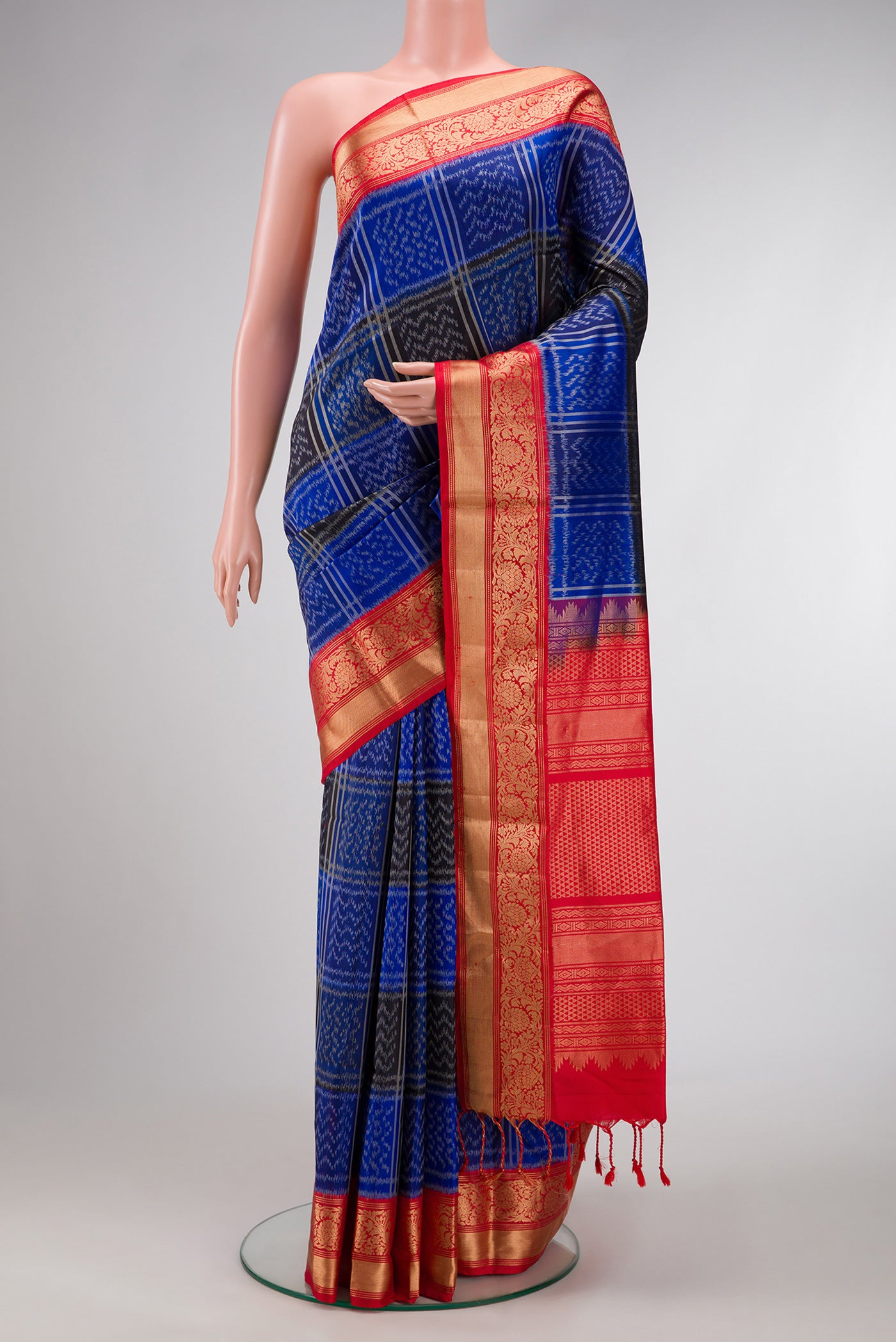 Royal Blue Dual Tone Soft Silk Saree with Ikat Print on the body and Zari Border.  displayed on a mannequin